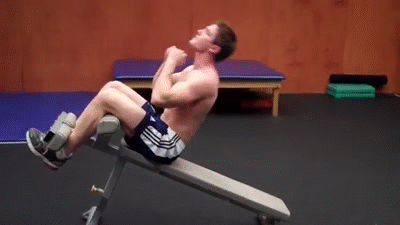 Man doing Weighted Decline Bench Sit-Up