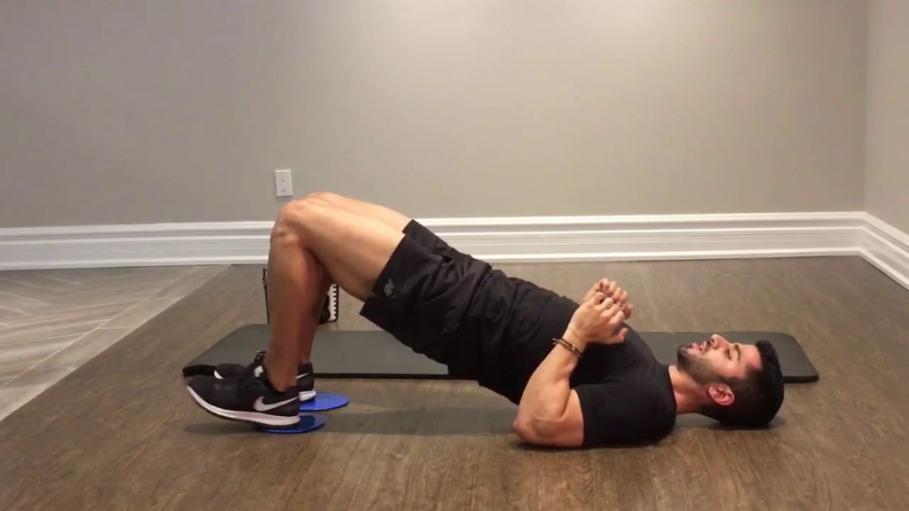 Man doing Sliding Leg Curls