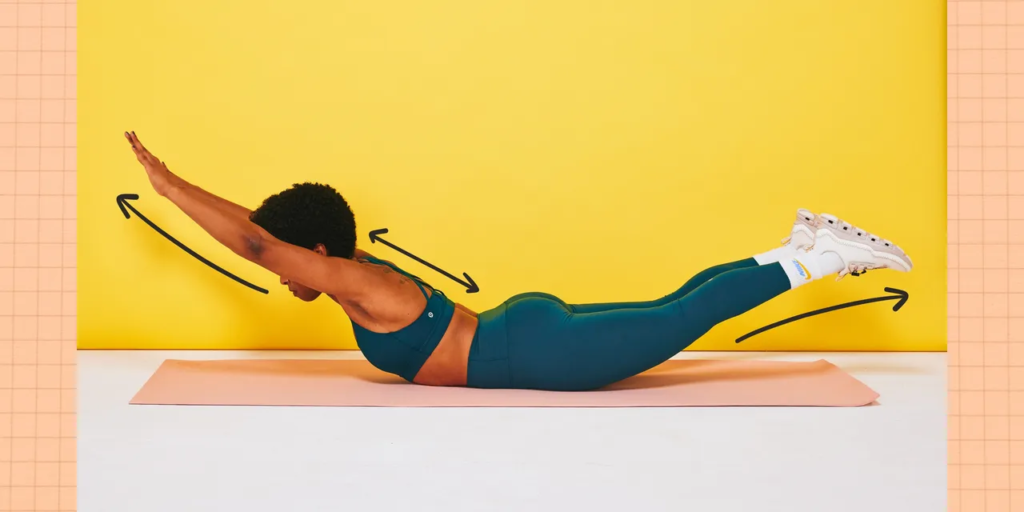 Woman doing Superman Hold with Hamstring Focus