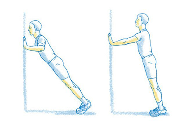 Boy doing Wall Push Ups (Illustration photo)