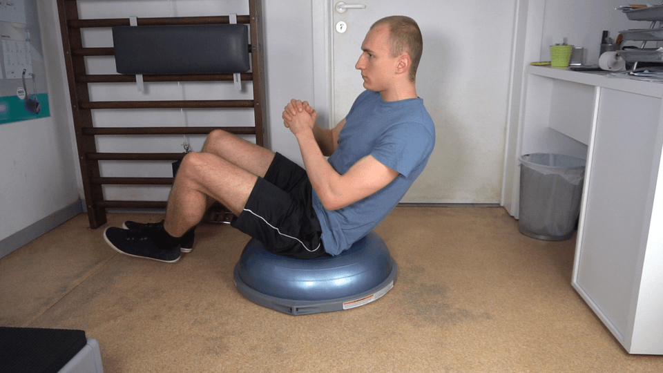 Man doing BOSU Russian Twist