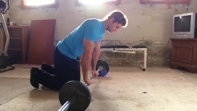 Man doing Barbell Rollouts
