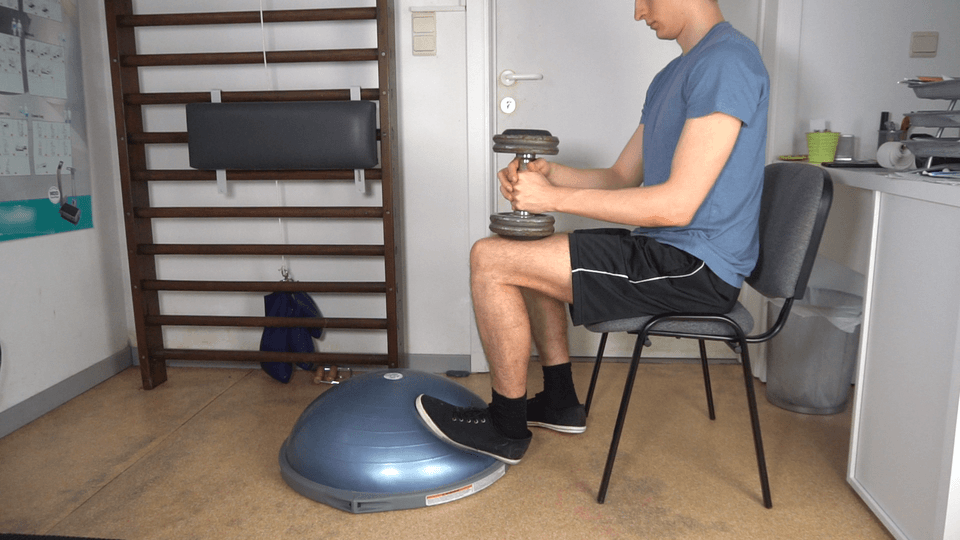 Man doing Bosu Ball Seated Calf Raises