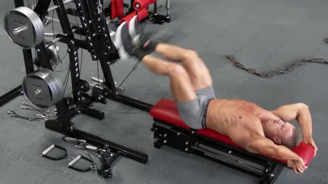 Man doing Cable Leg Raise