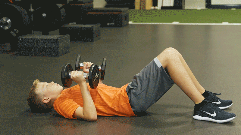 Man doing Dumbbell Floor Press