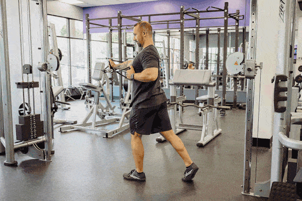 Man doing Kneeling Hi-Lo Cable Twist