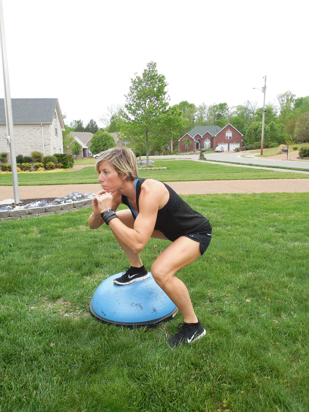 Woman doing Bosu Ball Sumo Squats