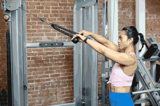 Woman doing High Cable Face Pull