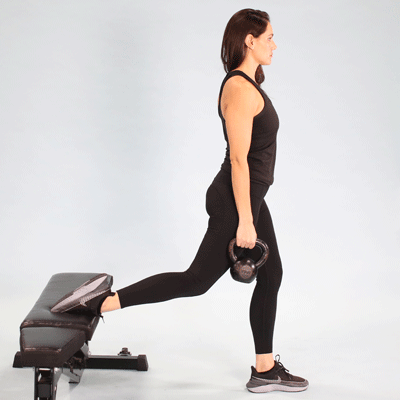 Woman doing Kettlebell Bulgarian Split Squat