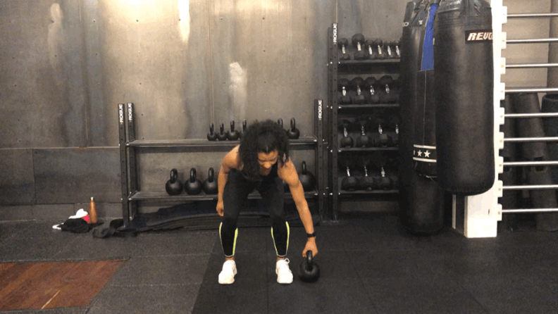 Woman doing Kettlebell Suitcase Deadlift