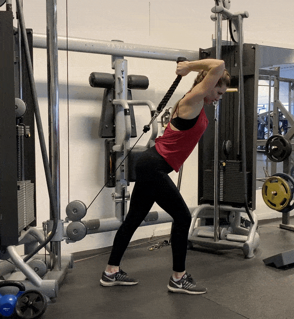 Woman doing Overhead Cable Tricep Extension