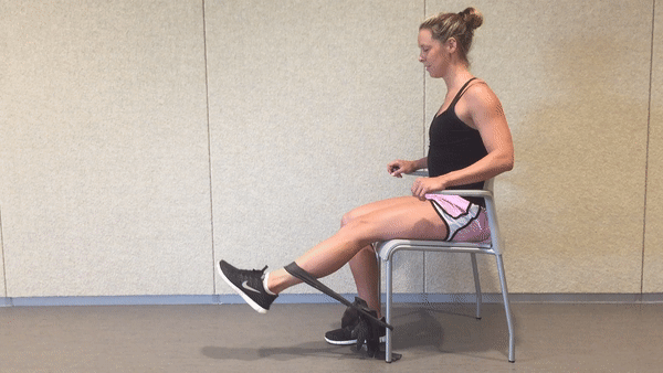 Woman is doing Banded Leg Extensions